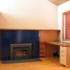 Office - fir and teak cabinetry, enameled steel fireplace