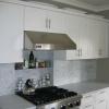 Painted frame and panel casework, carrera marble counters